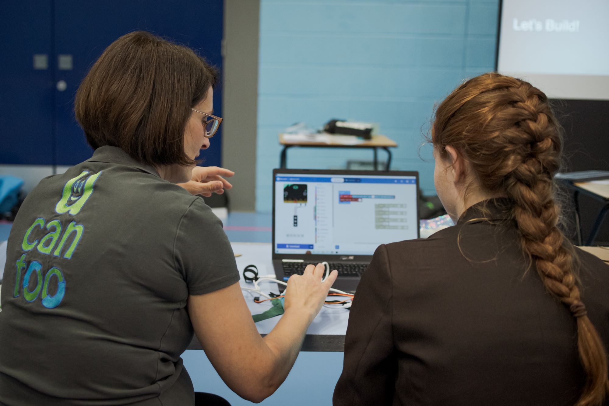 drone workshop 42 - Drone Assault Course Workshop using microbits. Su explaining a programming solution to a year 11 student